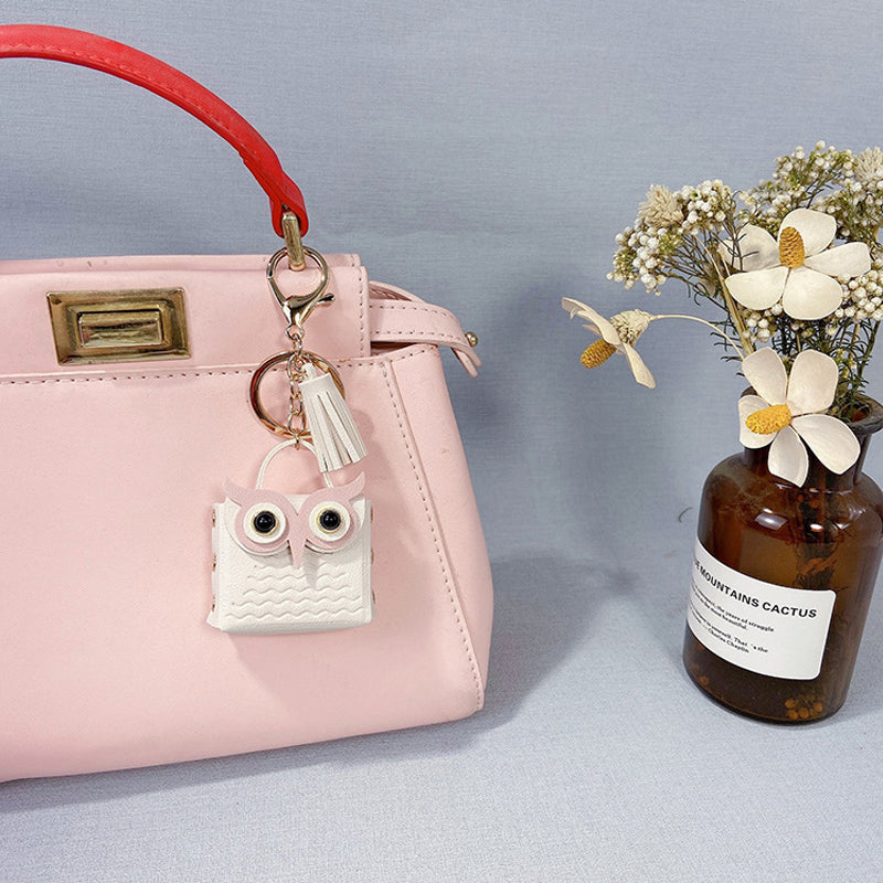 White mini handbag keychain, elegant accessory and functional storage for small treasures