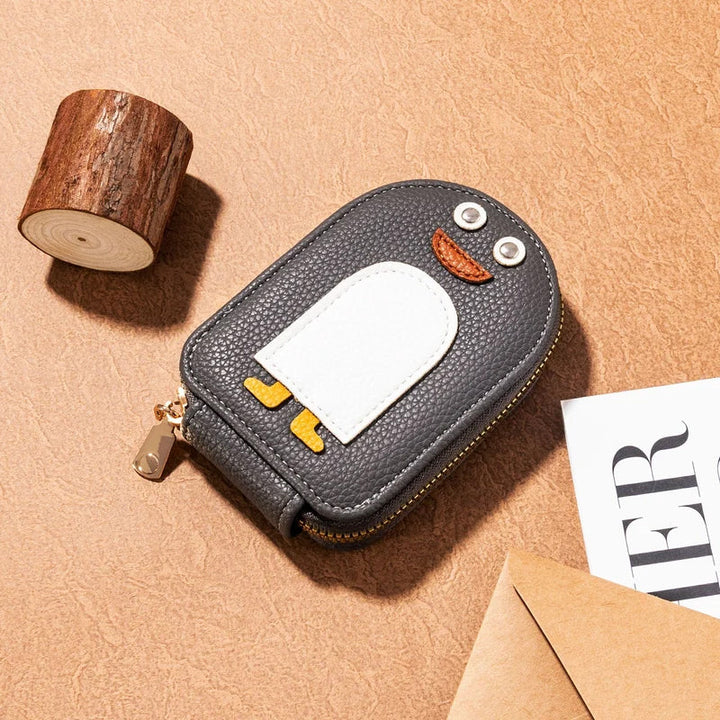 Back view of the women's compact PU leather wallet with cute penguin detail.