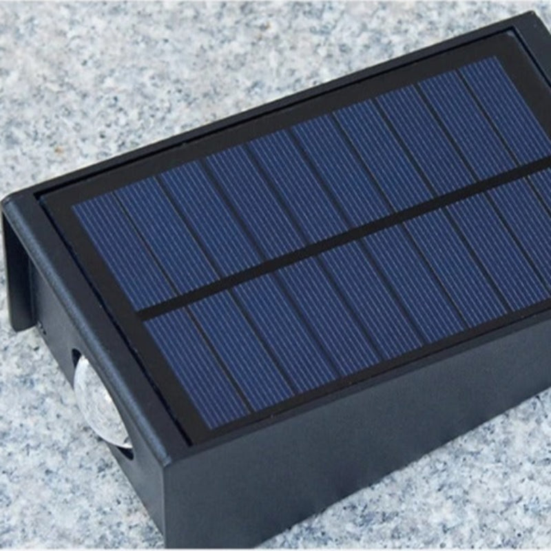 "Eco-friendly solar wall light with up and down illumination, modern aluminum and glass design, for outdoor decor."