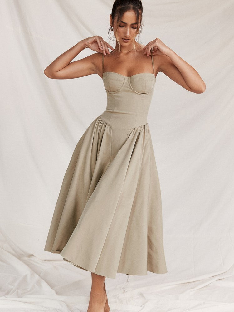 Women's formal midi dress with an elegant pleated hem, suitable for evening and special occasions.