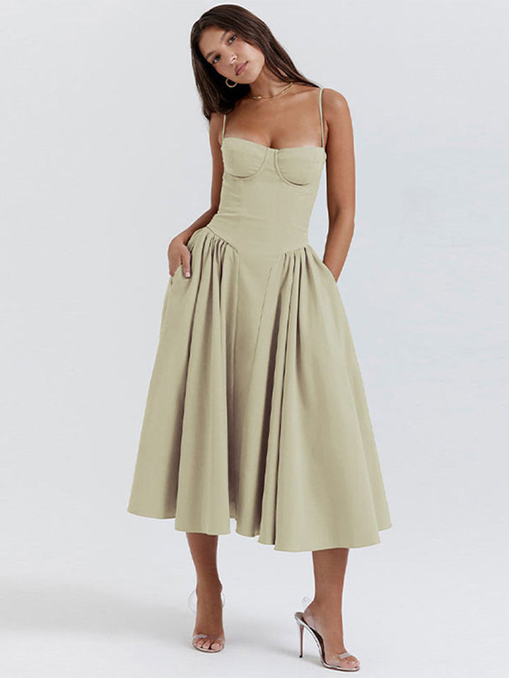 Amara elegant fashion midi dress, featuring a sophisticated pleated hem and backless style.