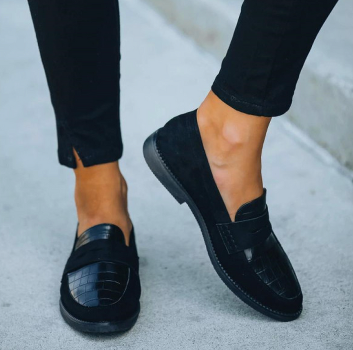 Stylish women's fashion loafers with a unique croc-embossed design, providing easy slip-on wear.