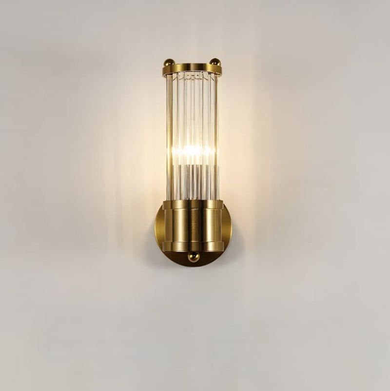 "Elegant cylindrical glass wall light in gold or chrome with modern design, ideal for enhancing any room's ambiance."