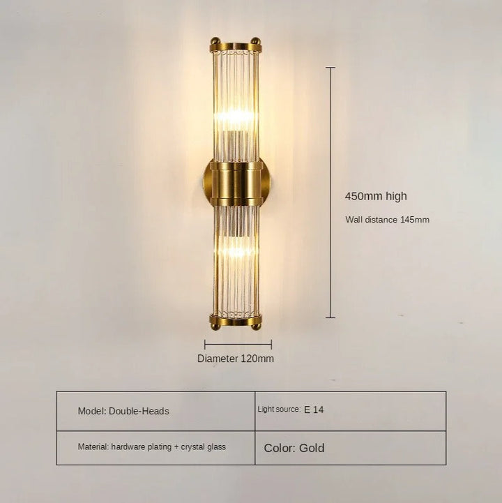 "Elegant cylindrical glass wall light in gold or chrome with modern design, ideal for enhancing any room's ambiance."