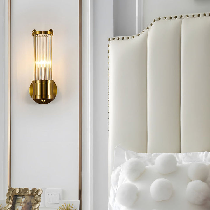 "Elegant cylindrical glass wall light in gold or chrome with modern design, ideal for enhancing any room's ambiance."