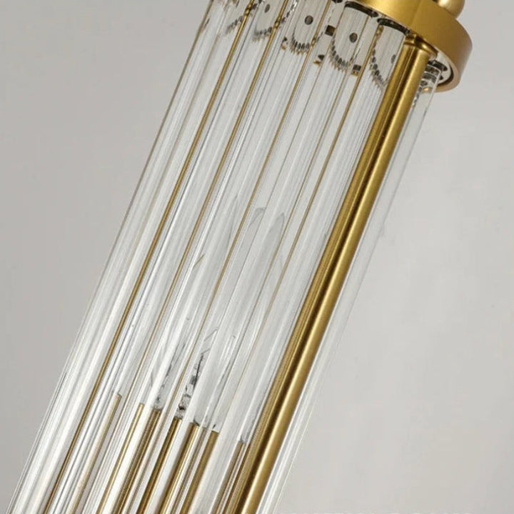 "Elegant cylindrical glass wall light in gold or chrome with modern design, ideal for enhancing any room's ambiance."