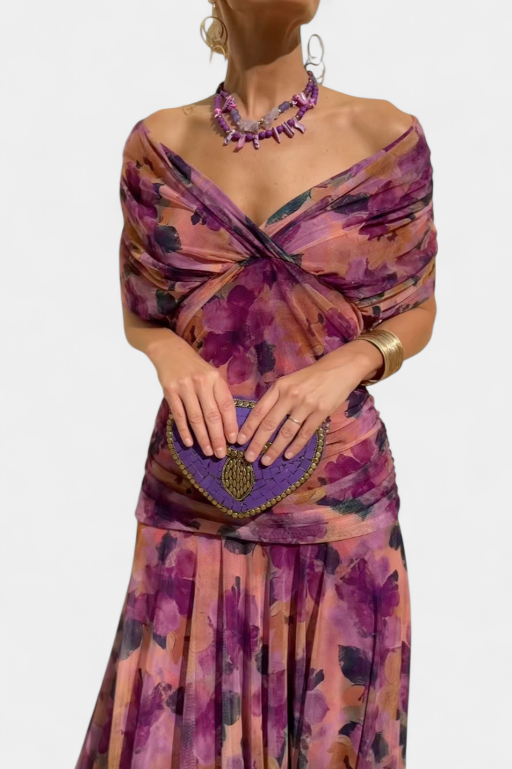 Vibrant floral patterned elegant maxi dress for women, featuring a flattering V-neck and pleated waist.