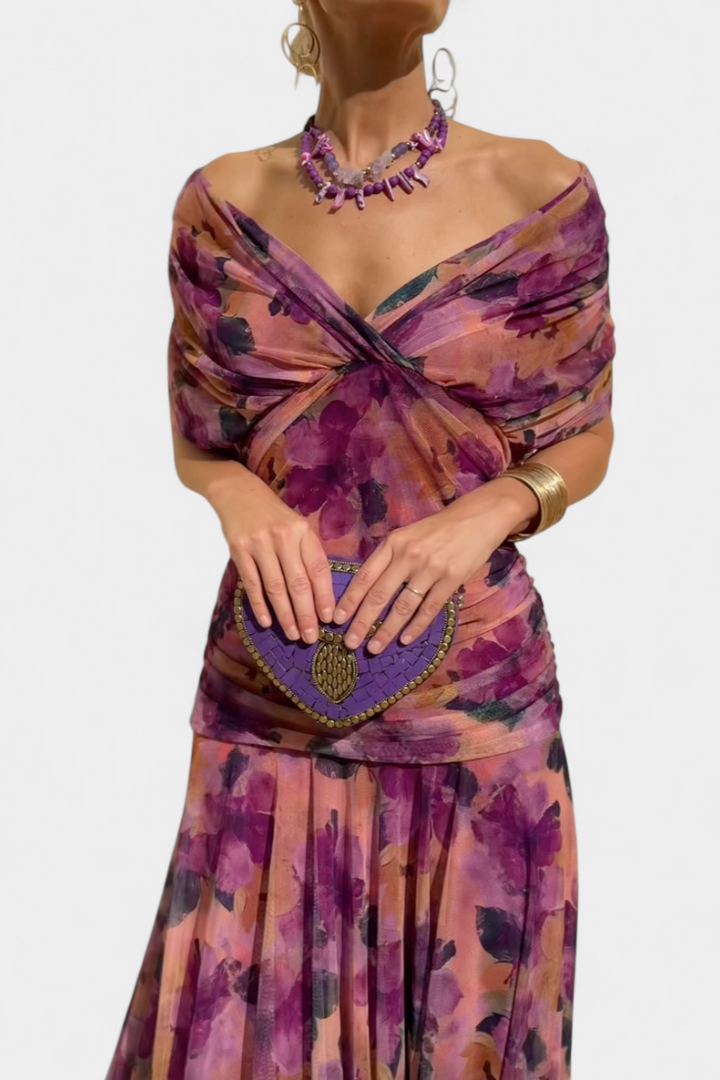 Vibrant floral patterned elegant maxi dress for women, featuring a flattering V-neck and pleated waist.