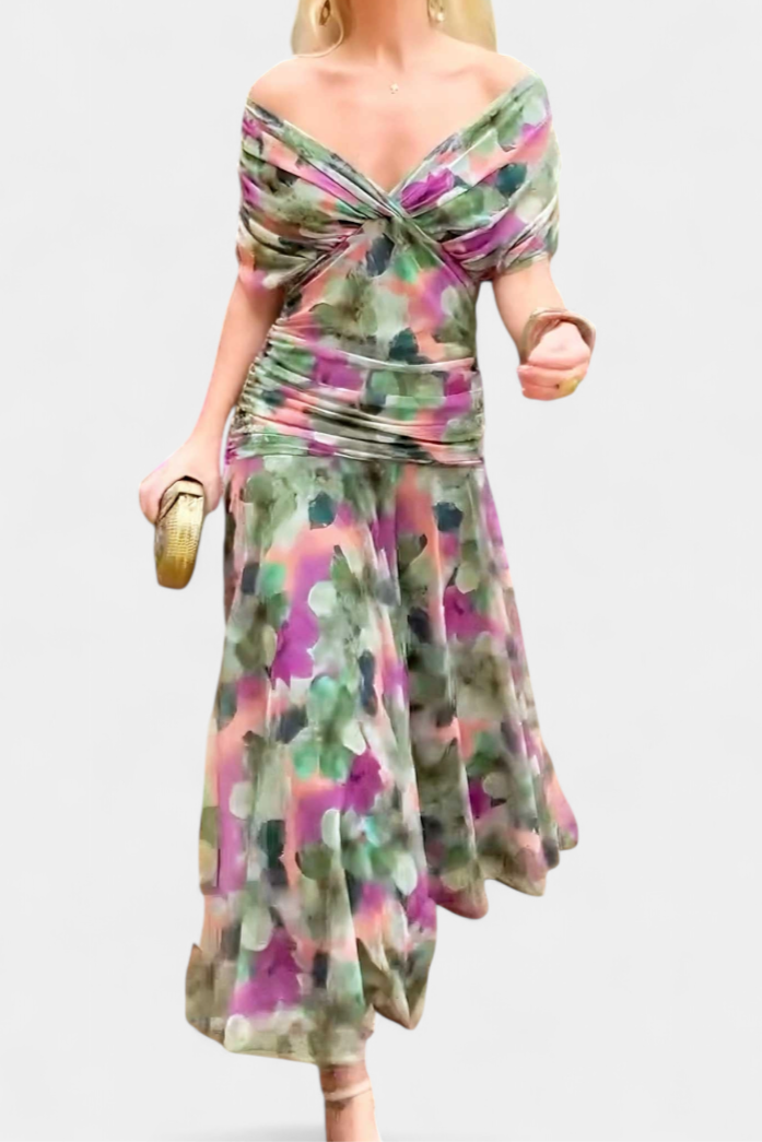 Close-up of the vibrant floral print and delicate pleated waist on this women's elegant maxi dress.