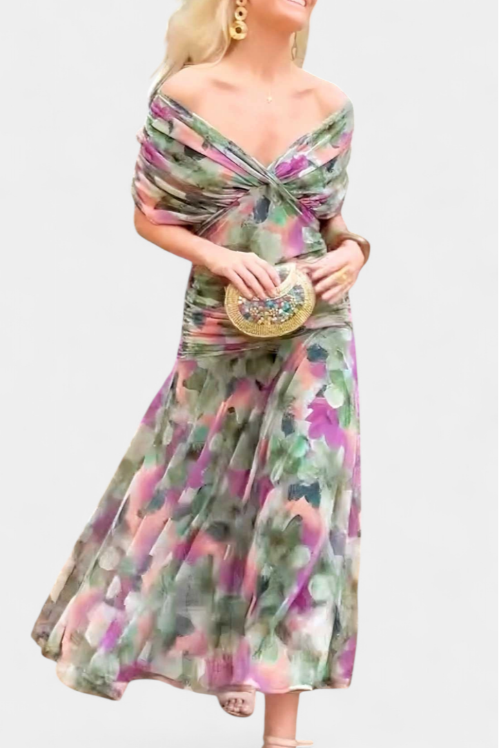 Full length view of a woman in an elegant floral maxi dress with pleated waist, ideal for events.