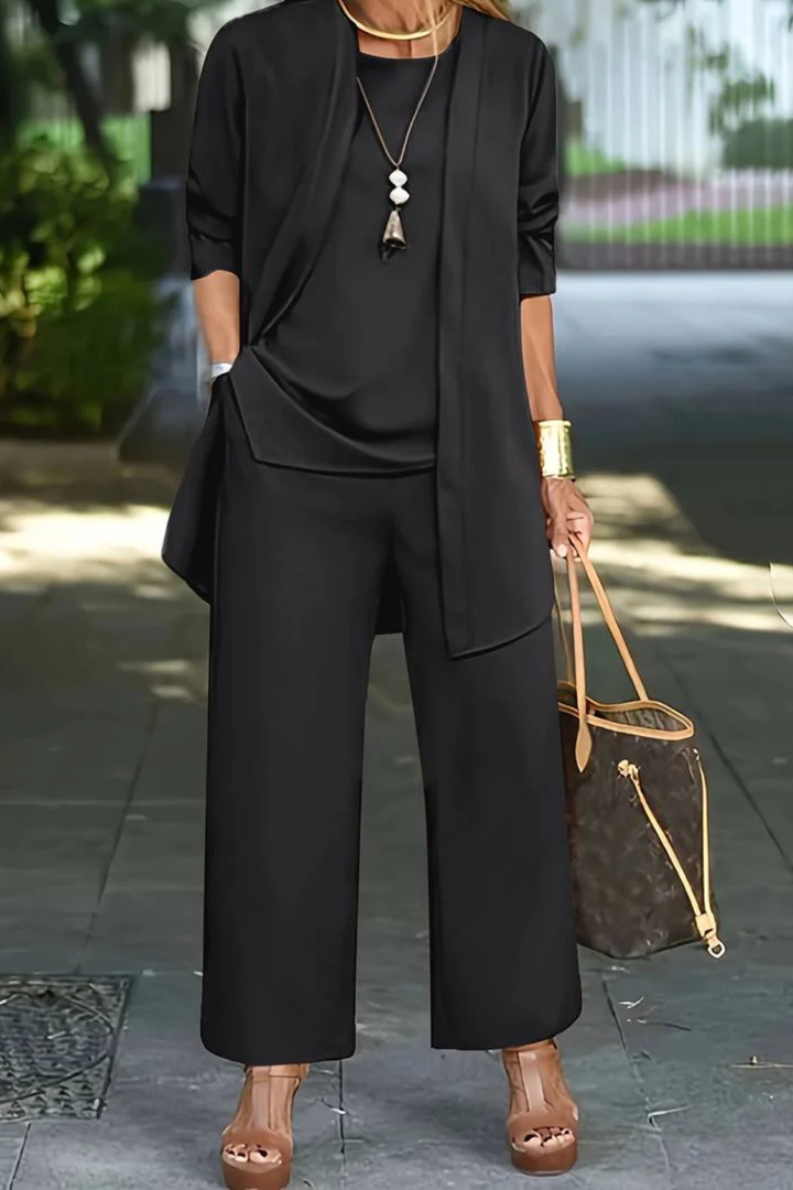 Classic black women's 3-piece suit, a versatile elegant outfit for business or special occasions.