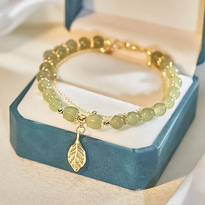 Fashionable Hetian jade bracelet for women, adorned with delicate gold leaf, a timeless accessory
