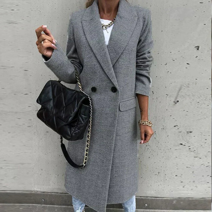 Women's long elegant button coat, a stylish classic for autumn/winter fashion.