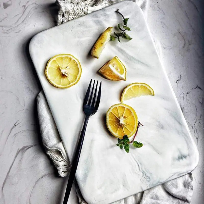 Elegant marble cutting board with polished finish, ideal for gourmet cooking and kitchen elegance, rectangular 10x16 inches.