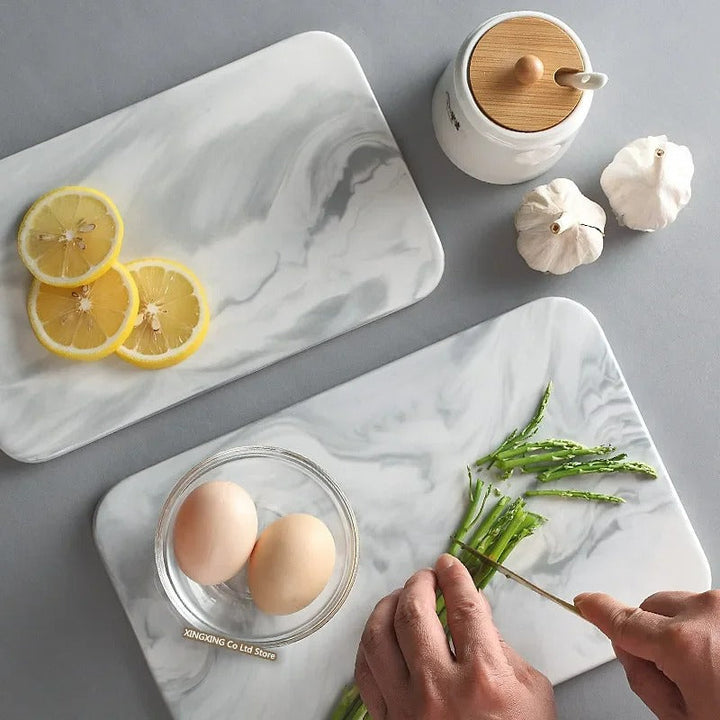 Elegant marble cutting board with polished finish, ideal for gourmet cooking and kitchen elegance, rectangular 10x16 inches.