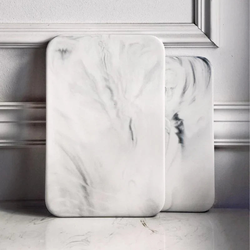 Elegant marble cutting board with polished finish, ideal for gourmet cooking and kitchen elegance, rectangular 10x16 inches.