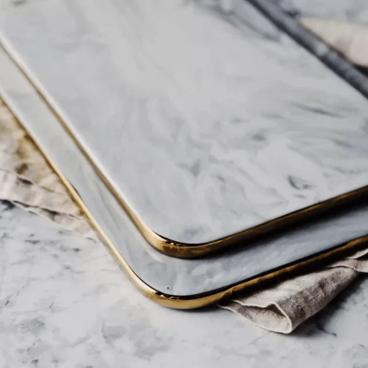 Elegant marble cutting board with polished finish, ideal for gourmet cooking and kitchen elegance, rectangular 10x16 inches.