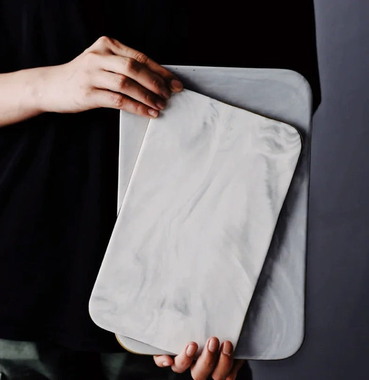 Elegant marble cutting board with polished finish, ideal for gourmet cooking and kitchen elegance, rectangular 10x16 inches.