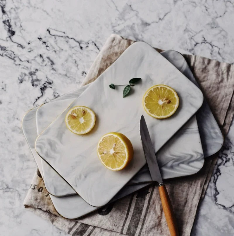 Elegant marble cutting board with polished finish, ideal for gourmet cooking and kitchen elegance, rectangular 10x16 inches.