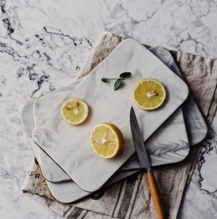 Elegant marble cutting board with polished finish, ideal for gourmet cooking and kitchen elegance, rectangular 10x16 inches.