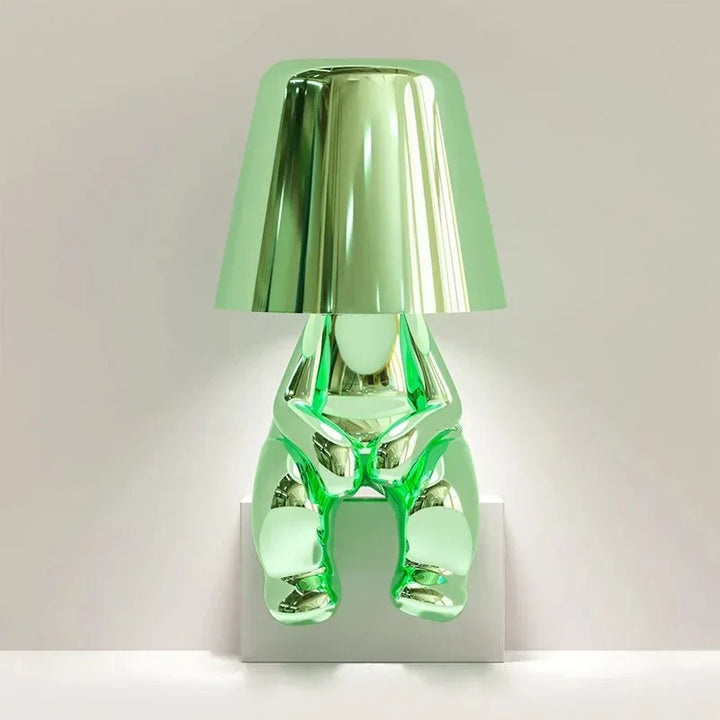 Elegant metallic thinker design table lamp with energy-efficient LED, featuring a unique thinker sculpture for modern decor.