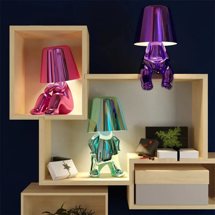 Elegant metallic thinker design table lamp with energy-efficient LED, featuring a unique thinker sculpture for modern decor.