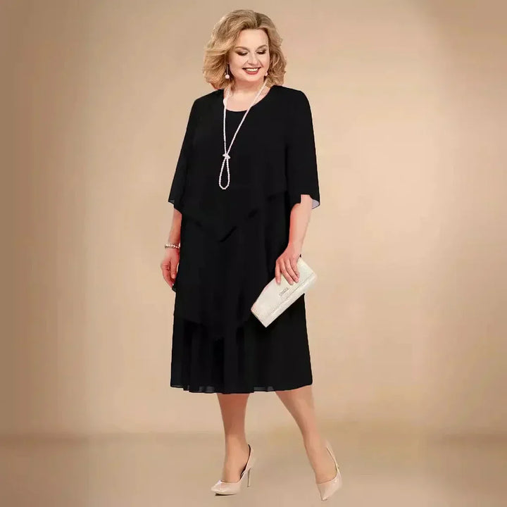 Elegant plus size women's asymmetrical midi dress for formal events. Sophisticated evening wear for special occasions.