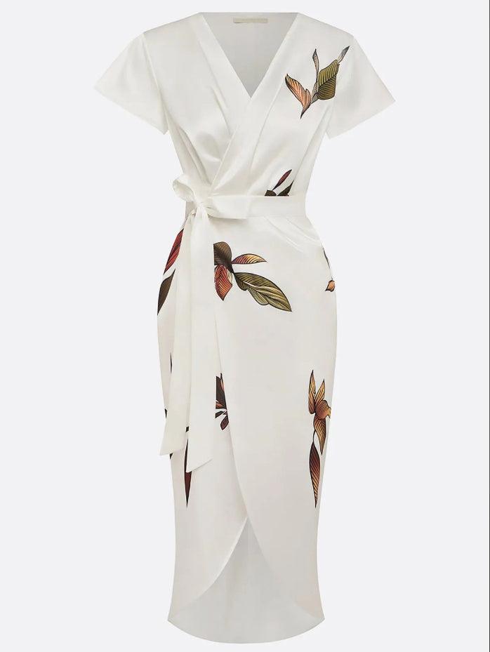 Women's elegant printed midi dress with a flattering wrap style and defining tie waist.