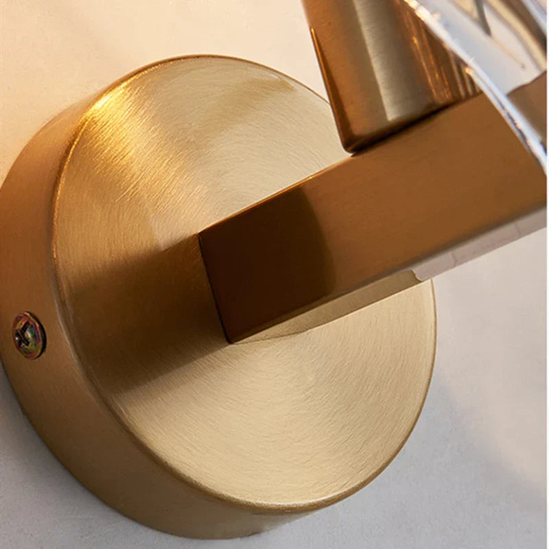 "Elegant shell-shaped glass wall sconce, inspired by coastal design, provides warm ambient lighting for home décor."