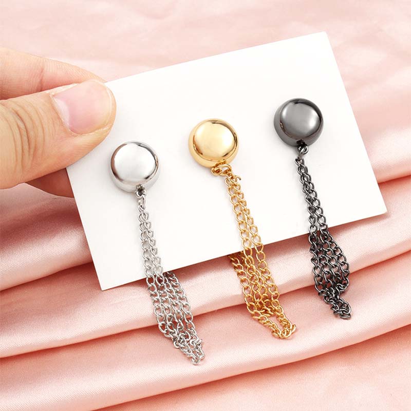 Pewter-finish magnetic clothing clip, a durable and chic solution for adjusting women's garments.