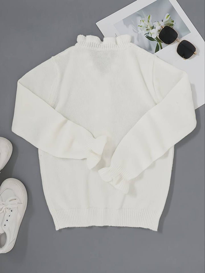 Chic women's ruffle top featuring decorative buttons on the front, ideal for casual and fashion wear.