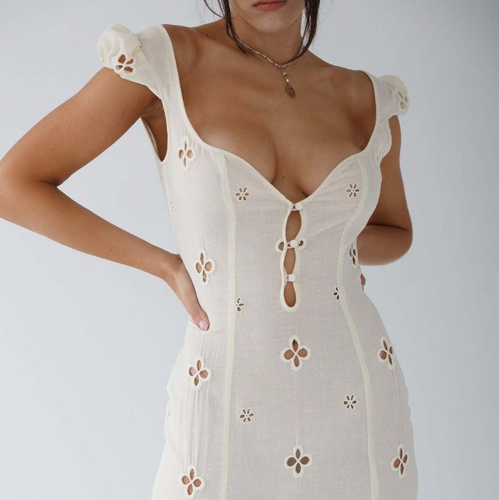 Elegant women's a-line midi dress in blush, perfect for a wedding guest or formal occasion.