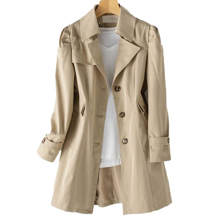 Close-up of the women's classic double-breasted trench coat showing button details and fabric texture.
