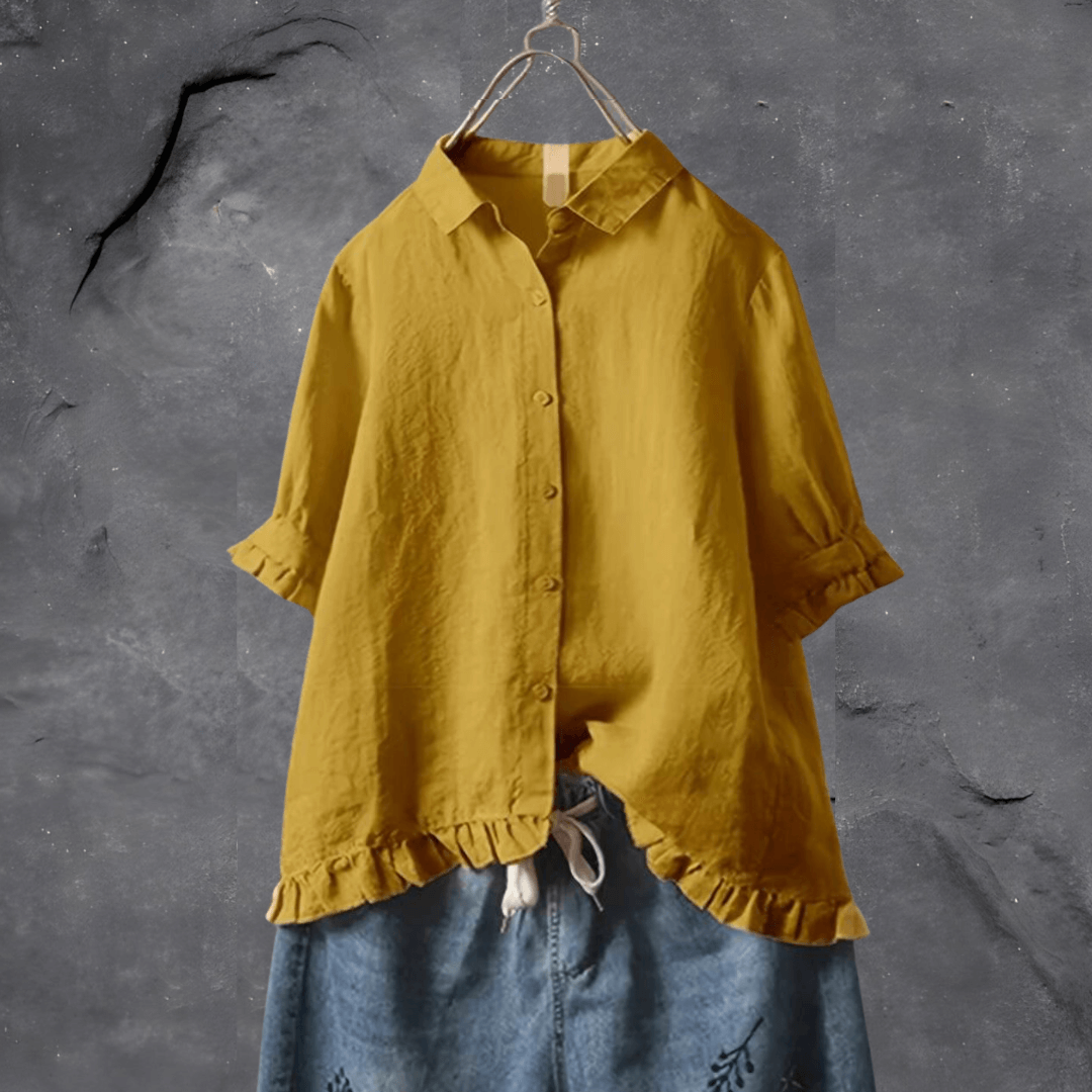 Elegant women's collared blouse with ruffled hem, short sleeves & button front, perfect for work or casual chic.