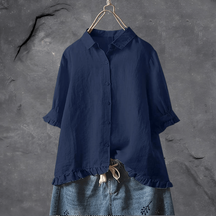 Versatile women's short sleeve blouse with ruffled hem; elegant for spring/summer workwear or casual outfits.