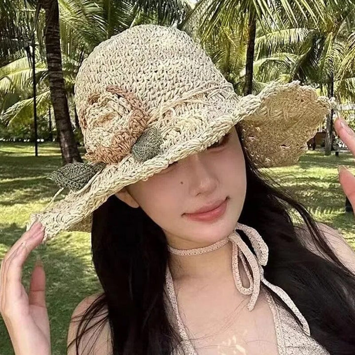 Summer essential: women's elegant crochet straw sun hat, enhanced by a charming ruffle.