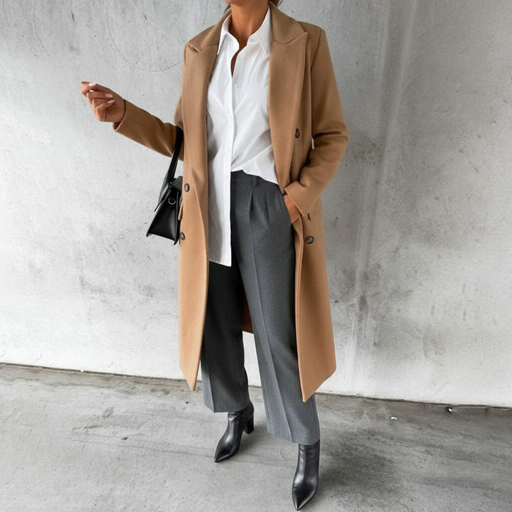 Classic women's double-breasted long winter coat. Elegant, warm outerwear for a sophisticated fall & winter look.