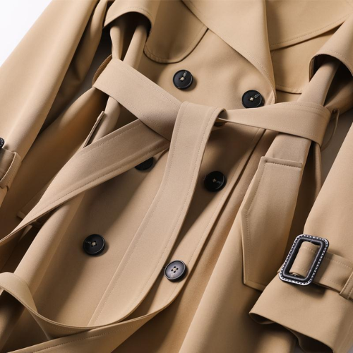 Versatile women's double-breasted trench coat, elegant outerwear for spring, fall, and chic layering.