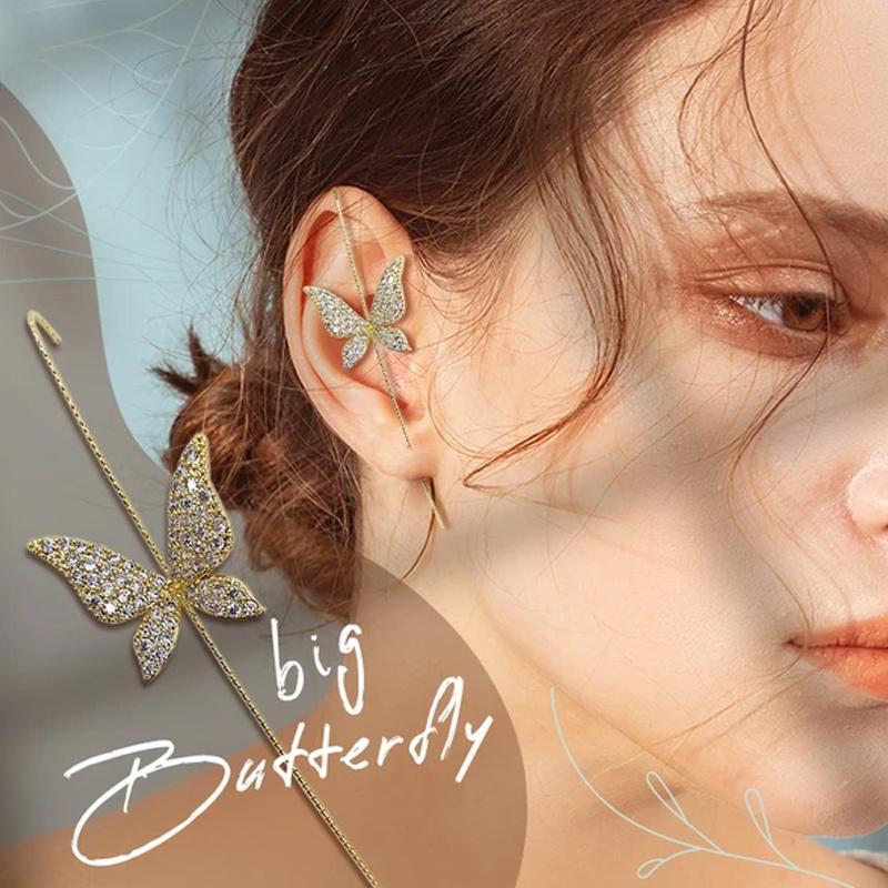 Hypoallergenic women's ear wrap crawler earring, featuring a curved design with embedded rhinestones. Macro detail.