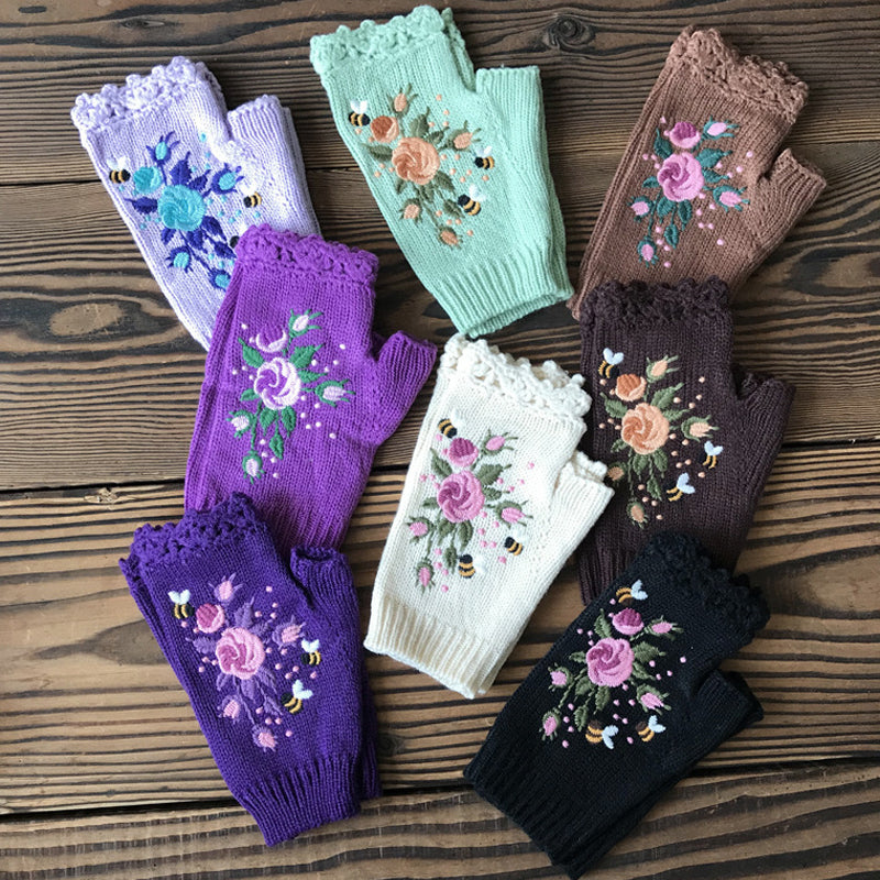 Elegant women's black winter gloves, featuring intricate floral embroidery, a must-have fashion accessory.