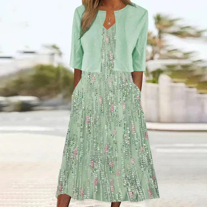 Elegant women's floral midi dress & cropped jacket set, perfect for summer parties or as a wedding guest outfit.
