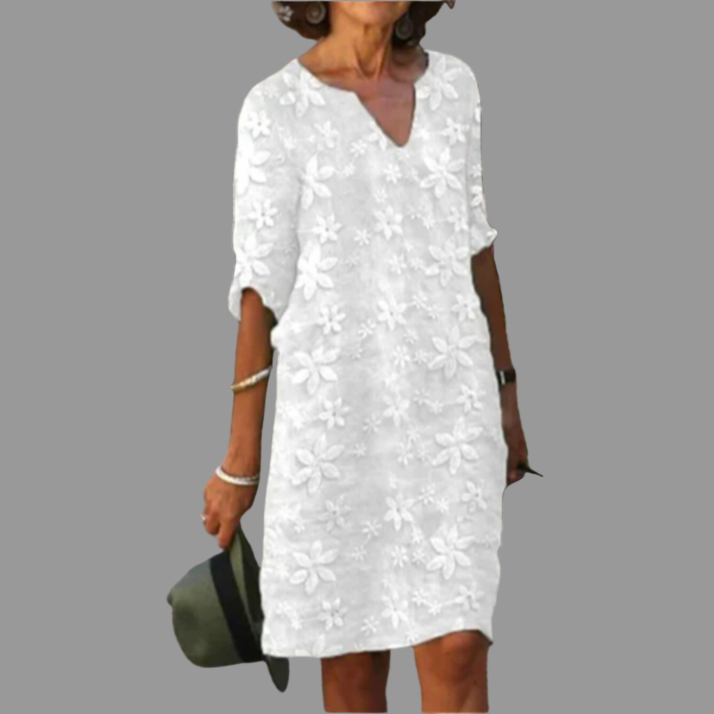 Elegant women's floral V-neck midi dress. Relaxed fit, perfect for summer casual wear or sophisticated occasions.