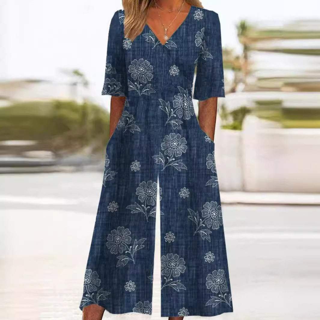 Elegant women's floral wide-leg jumpsuit with V-neck and elbow sleeves, perfect bohemian summer resort wear.
