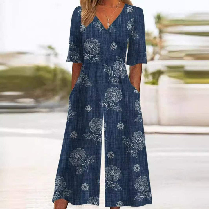 Chic women's V-neck floral wide-leg jumpsuit, bohemian style with elbow sleeves, perfect for elegant summer fashion.