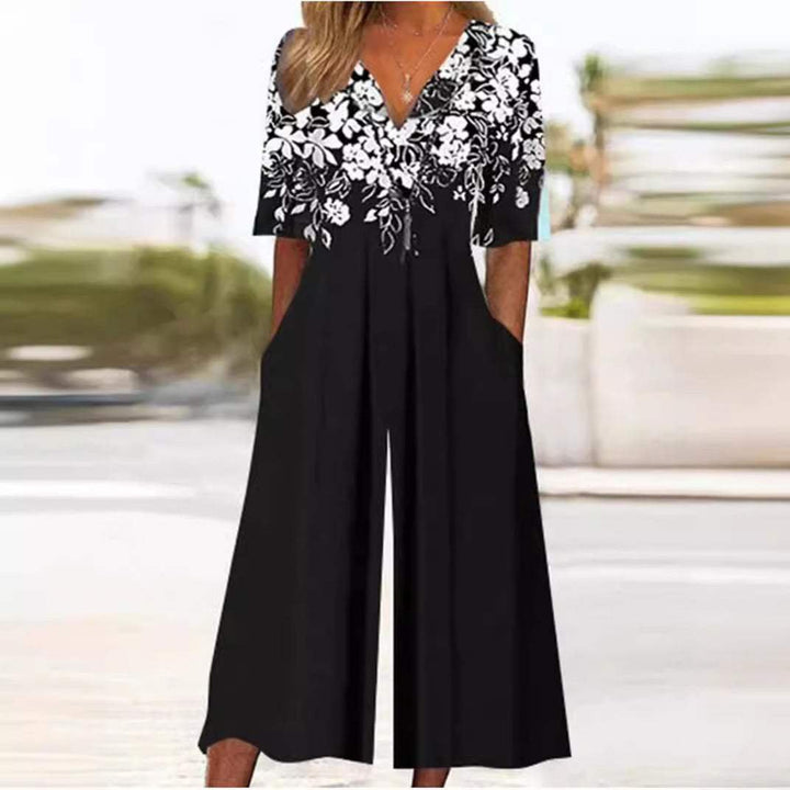 Beautiful women's floral wide-leg palazzo jumpsuit, V-neck & elbow sleeves, a comfortable bohemian summer outfit.