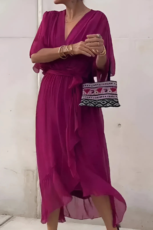 Model wearing elegant Seren style flowing maxi dress. A versatile women's long dress for formal or holiday occasions.