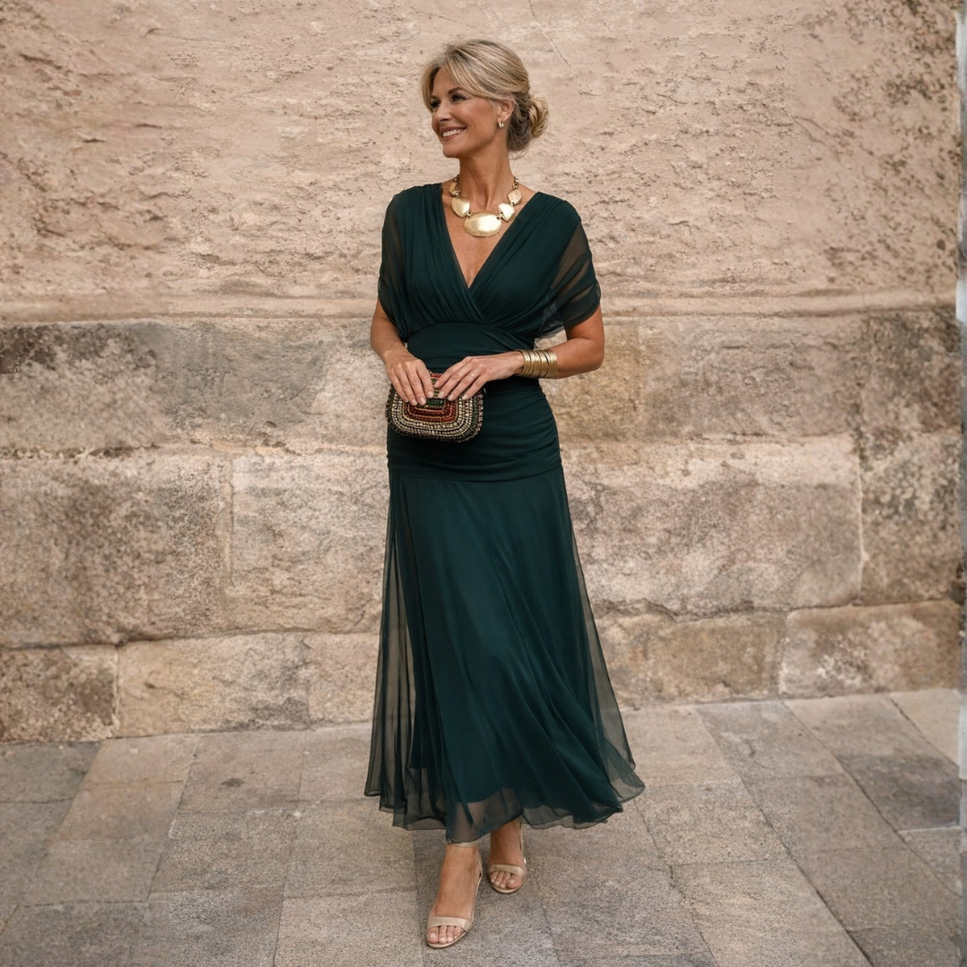 Elegant women's gathered V-neck midi dress with flutter sleeves, perfect for special occasions.