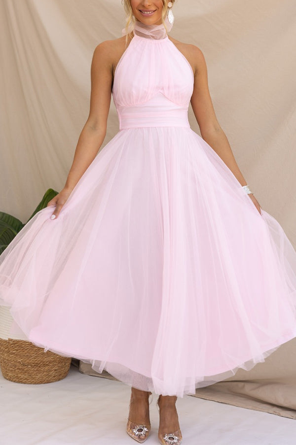 Close-up of the stylish halter neckline on an elegant women's maxi wedding guest dress. Sleeveless evening gown.