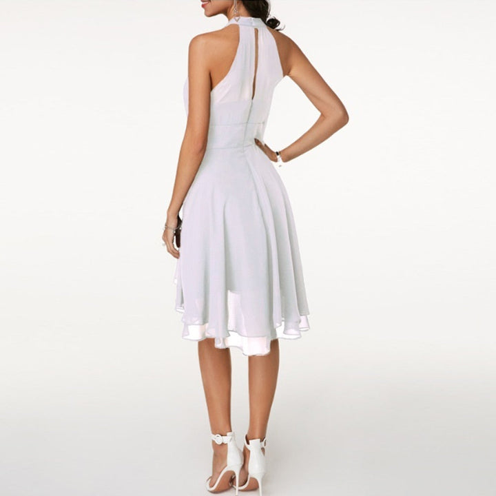 Chic women's sleeveless halter mini party dress with a flowing fluid drape, ideal for cocktail events.