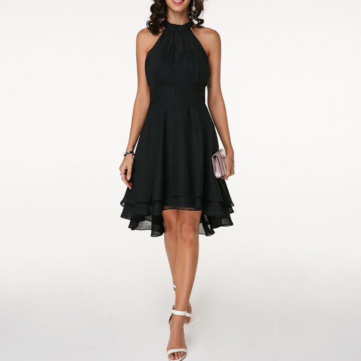 Stylish women's elegant halter mini dress, featuring a flattering fluid drape for evening wear.